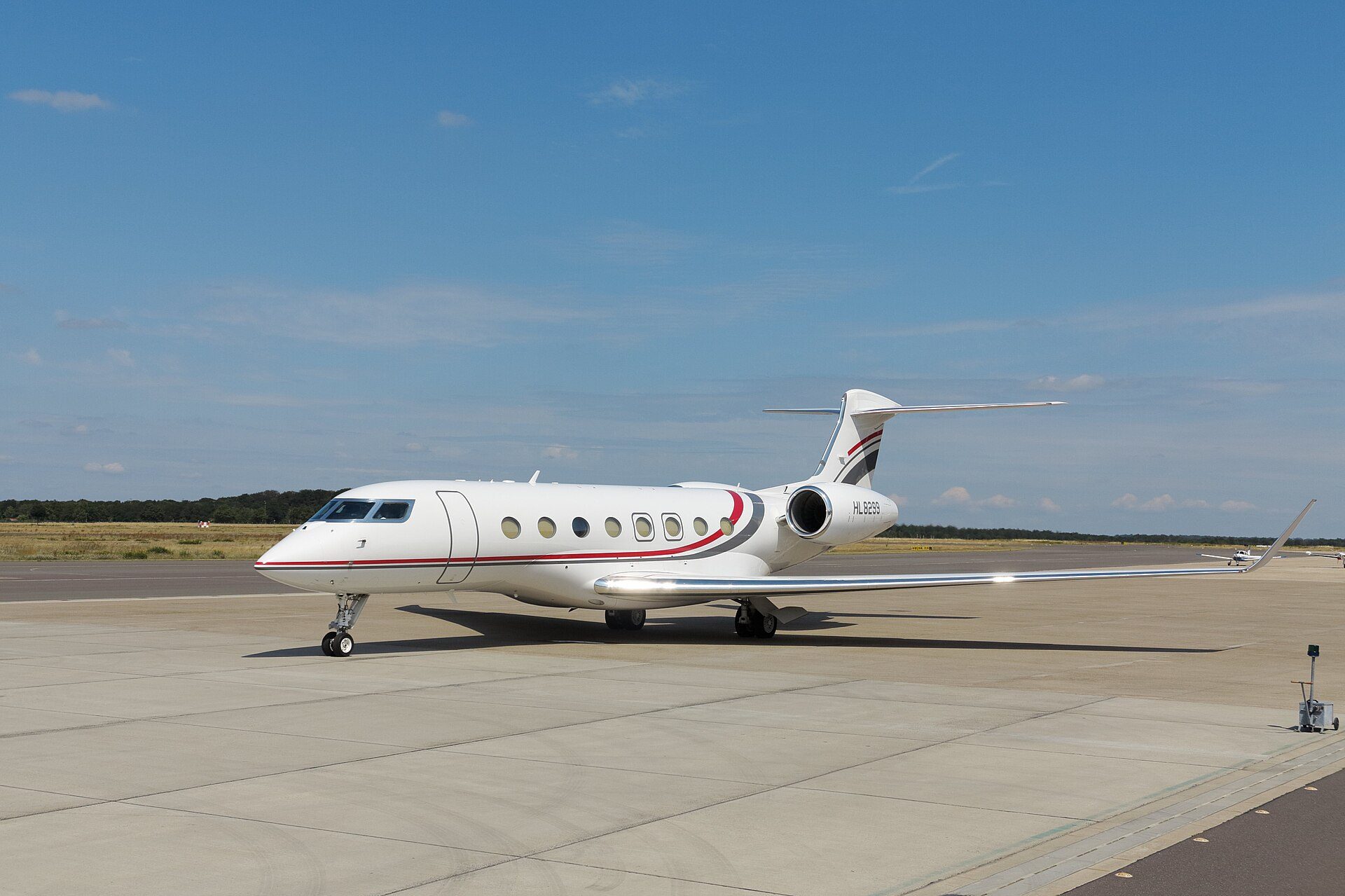 Private jet parked on an airport apron